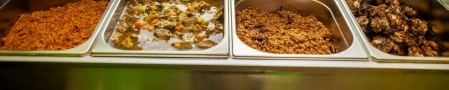 Image of different containers of caribbean food
